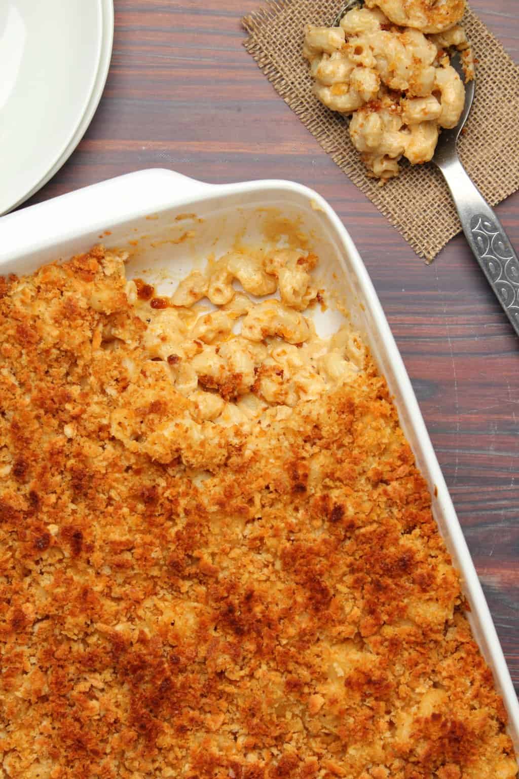 Baked vegan mac and cheese in a white dish. 