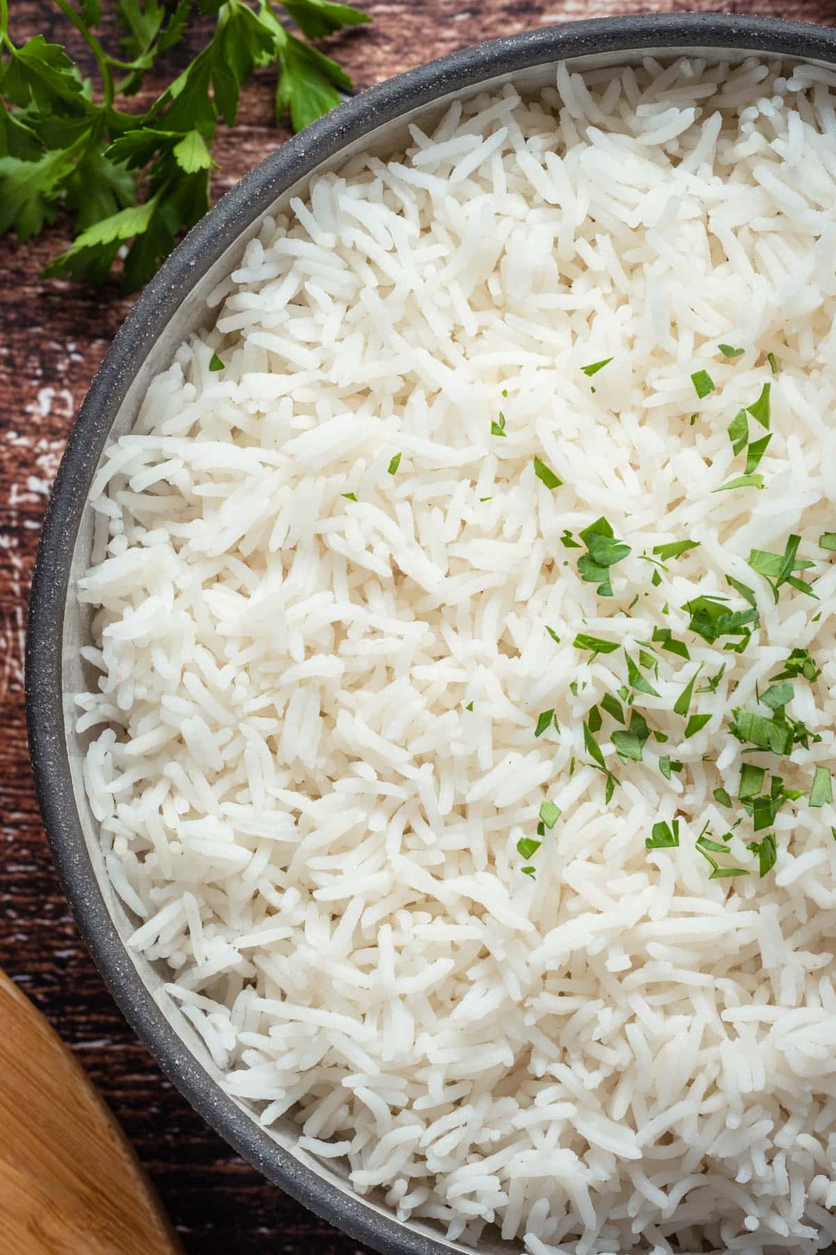 Basmati rice topped with fresh parsley.