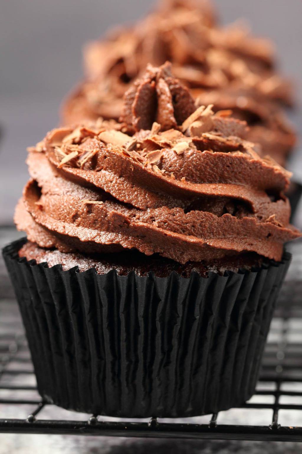 Classic vegan chocolate cupcakes topped with vegan chocolate buttercream and chocolate shavings. 