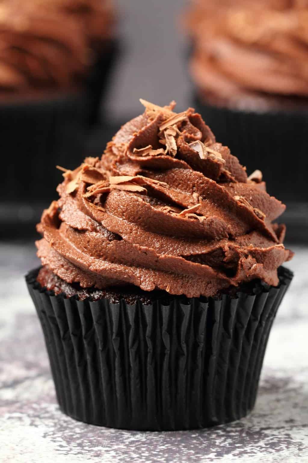 Classic vegan chocolate cupcakes topped with vegan chocolate buttercream and chocolate shavings. 