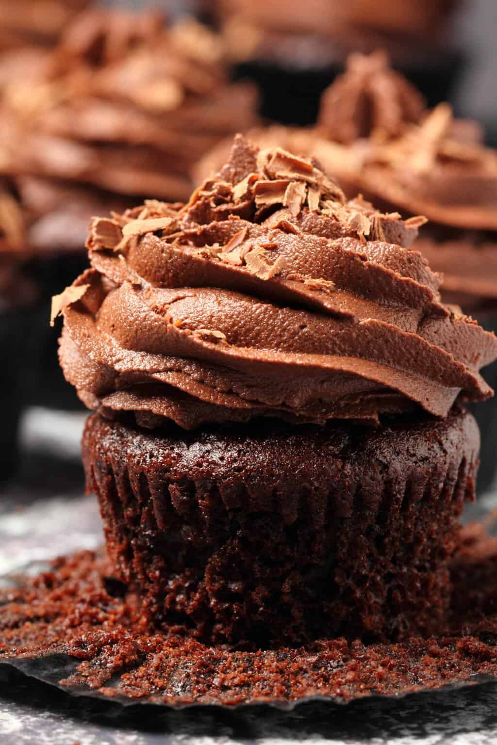 Classic vegan chocolate cupcakes topped with vegan chocolate buttercream and chocolate shavings. 