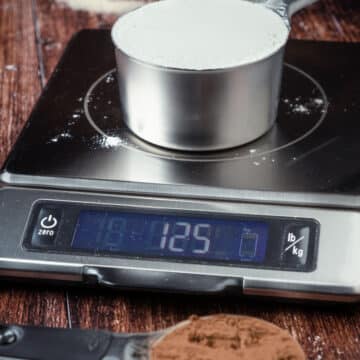 Cup of flour on a food scale.
