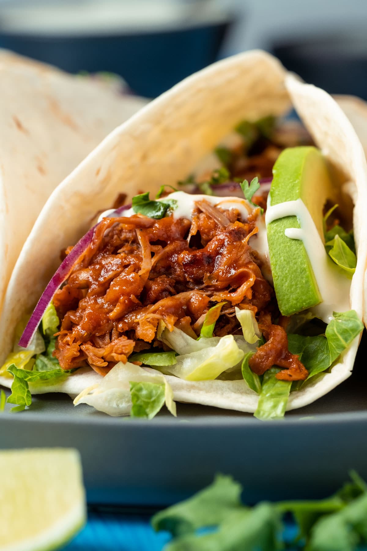 Jackfruit tacos on a gray plate.