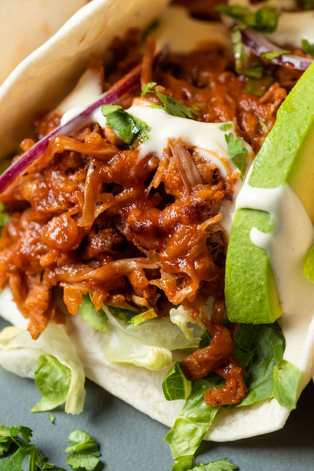 Jackfruit tacos on a gray plate.