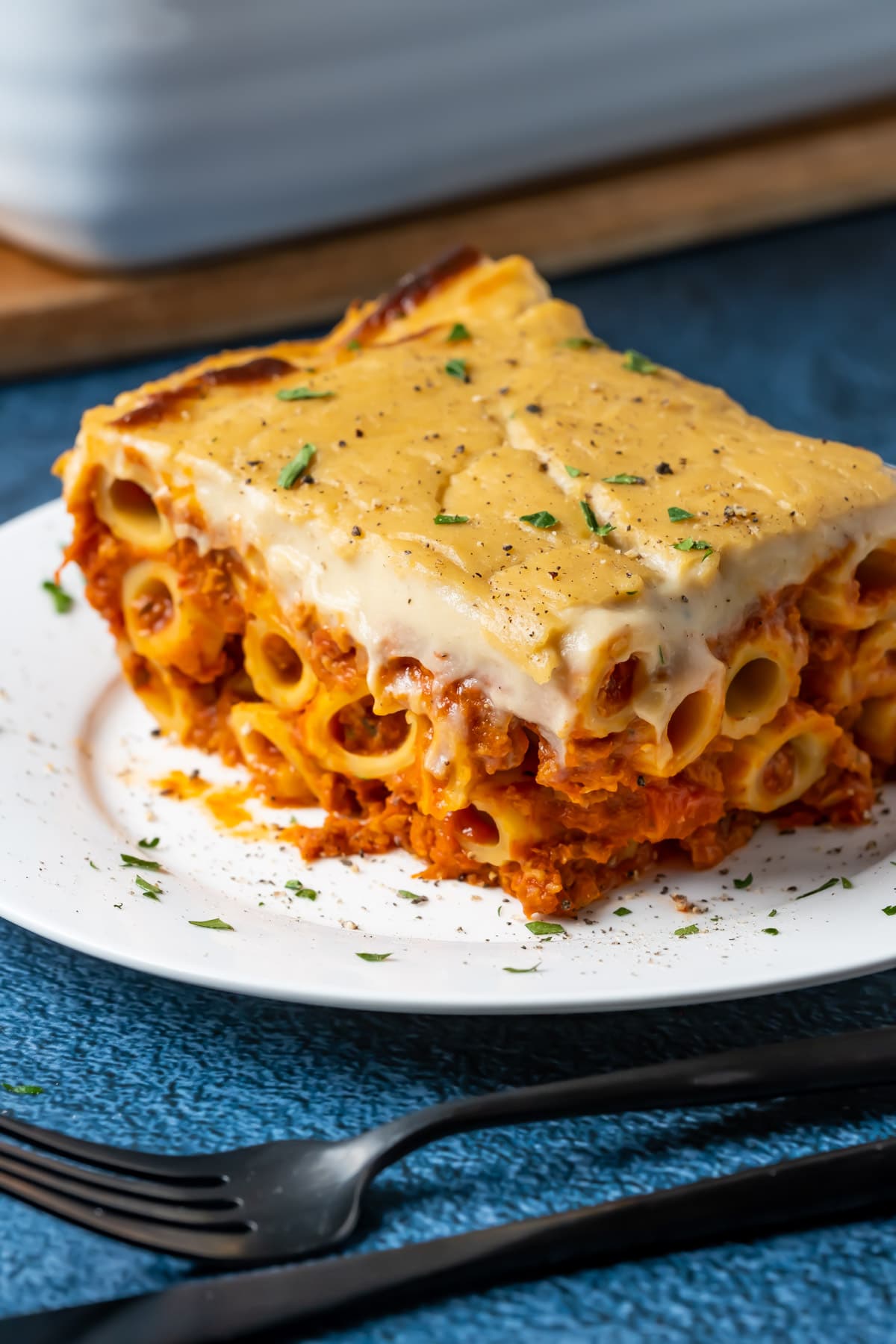 Slice of vegan baked ziti on a white plate.