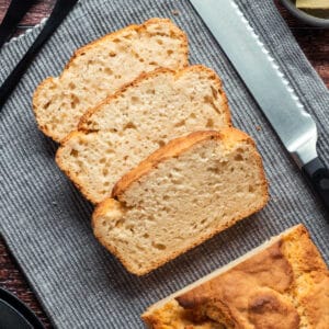 Sliced loaf of vegan beer bread on a napkin.