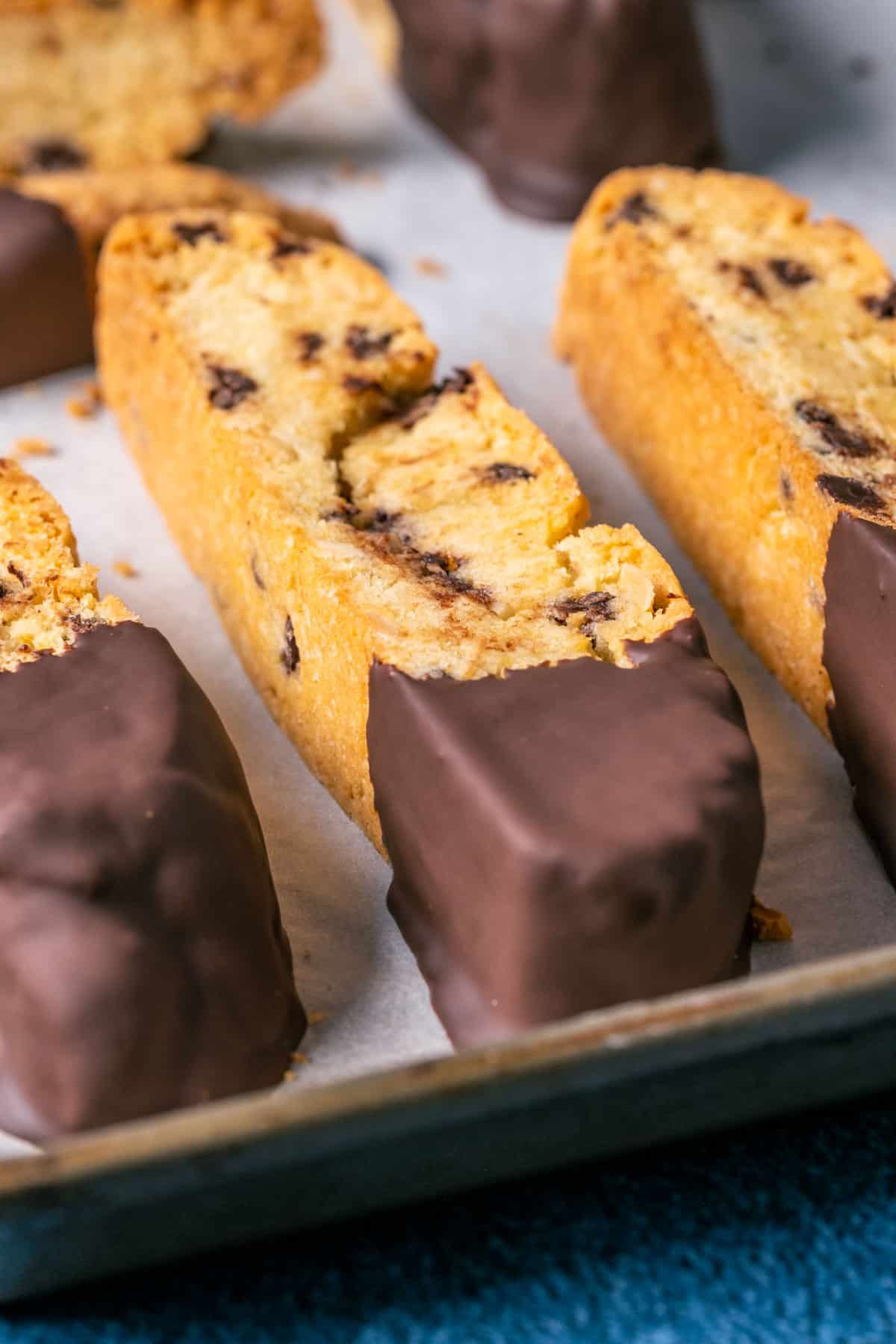 Vegan biscotti on a parchment lined tray.