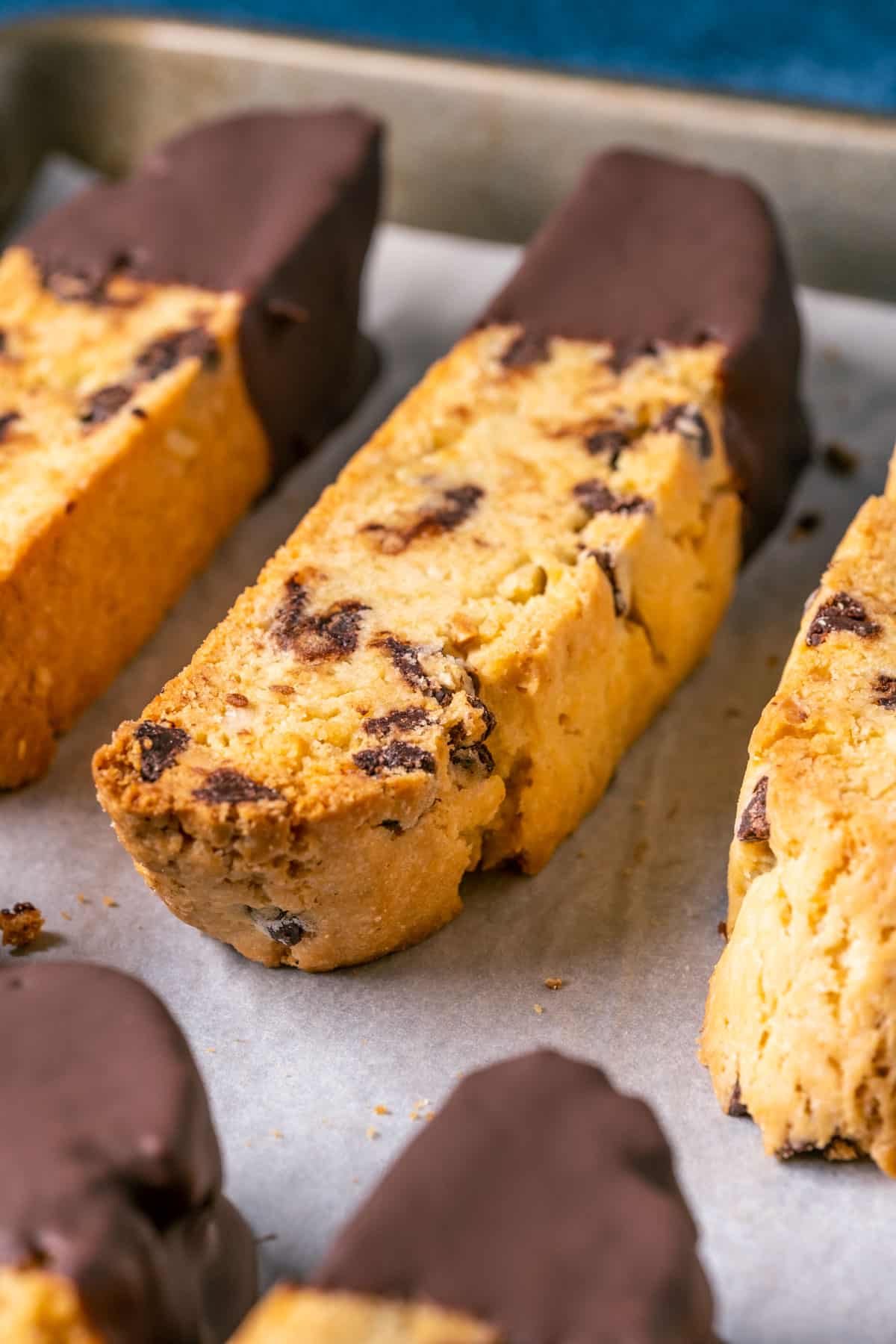 Vegan biscotti on a parchment lined tray.