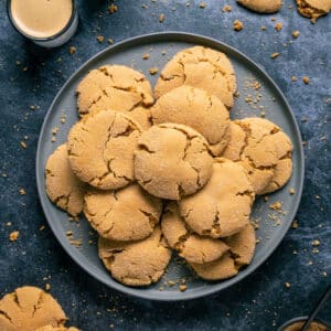 Vegan brown sugar cookies stacked up on a gray plate.