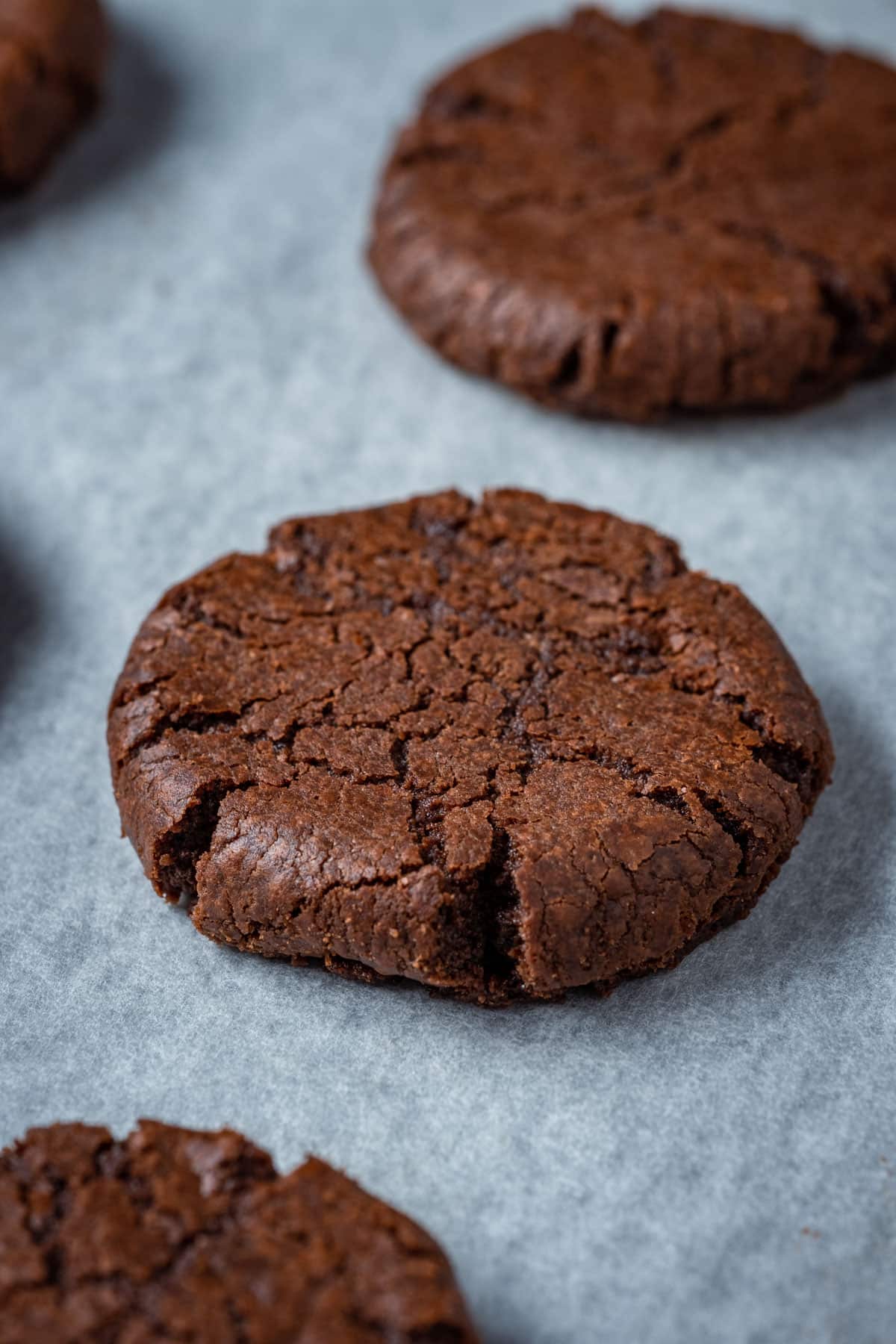 A close up of Vegan Brownie Cookies cooling on the baking sheet