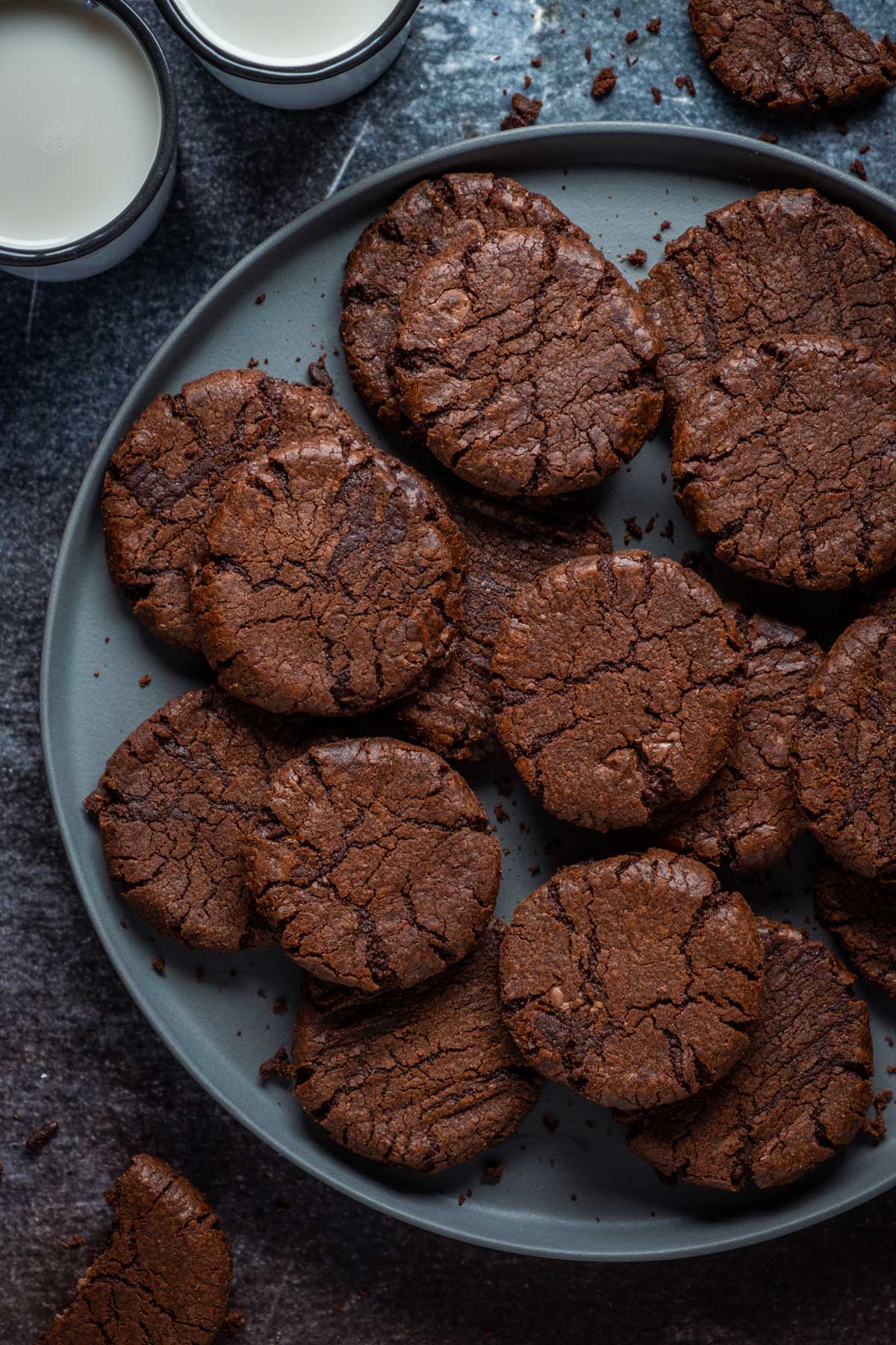 Vegan Brownie Cookies stacked on  gray plate.