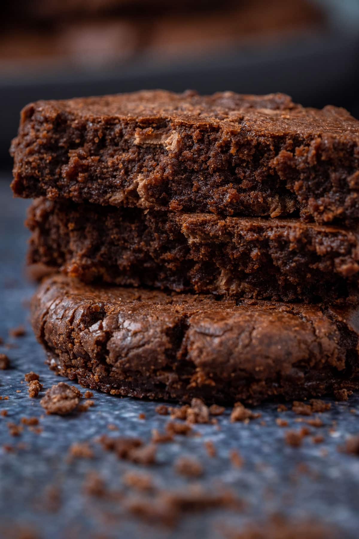 Vegan Brownie cookies broken up and stacked on top of each other