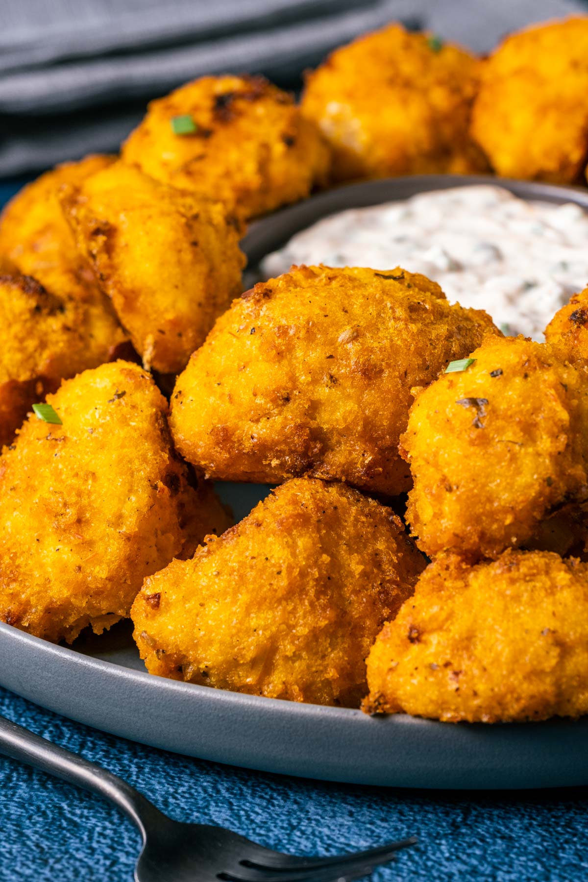 Buffalo cauliflower on a plate with ranch dressing.