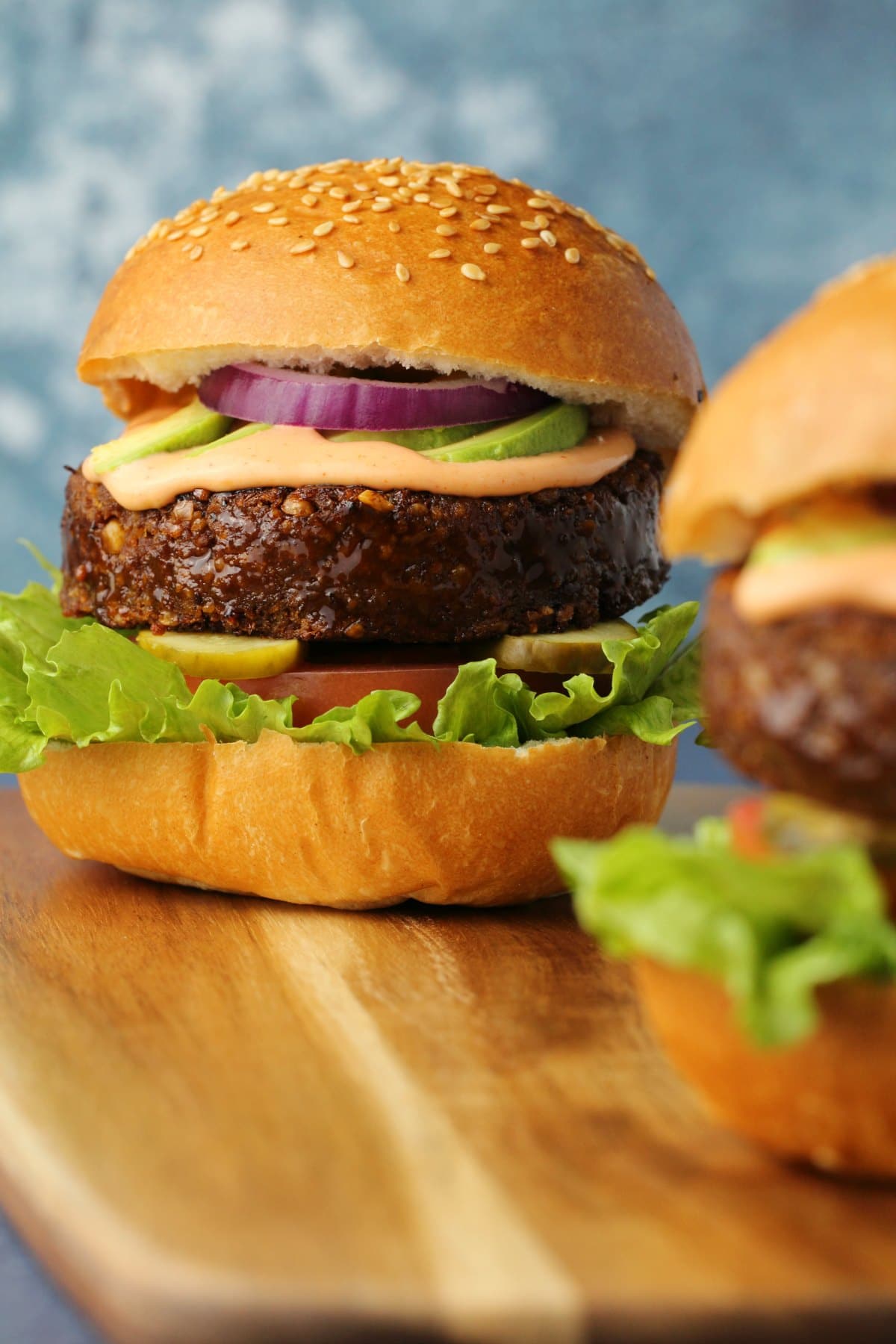 Vegan burgers on a wooden board. 