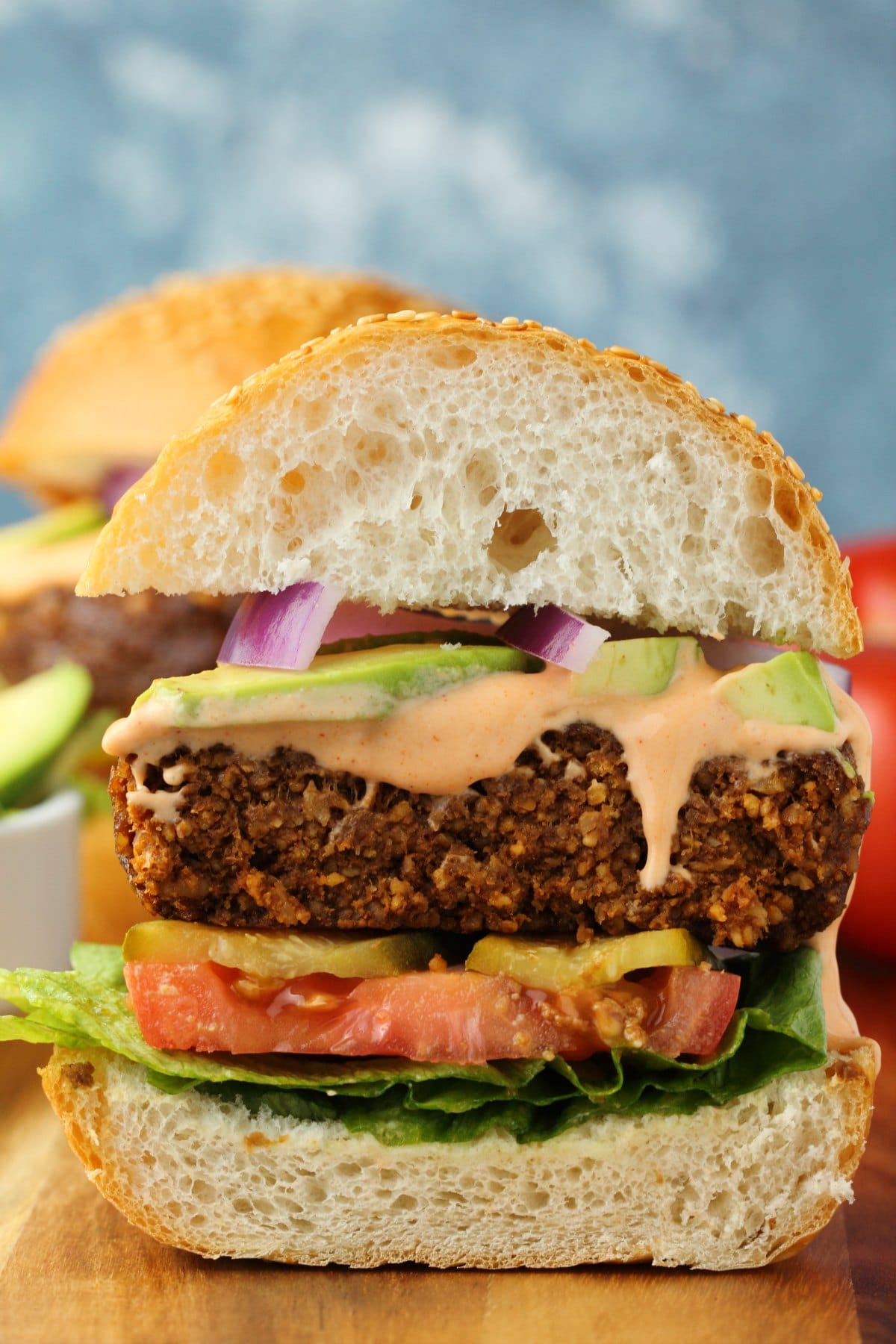 Vegan burger sliced in half to show the center. 