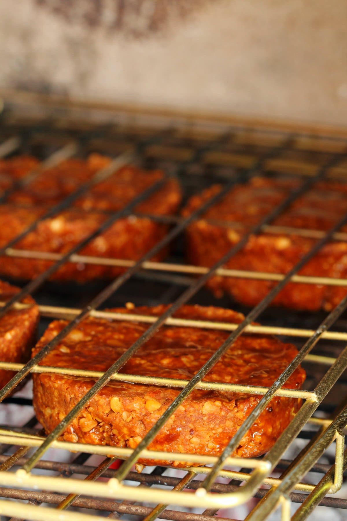 Vegan burger cooking on the grill.