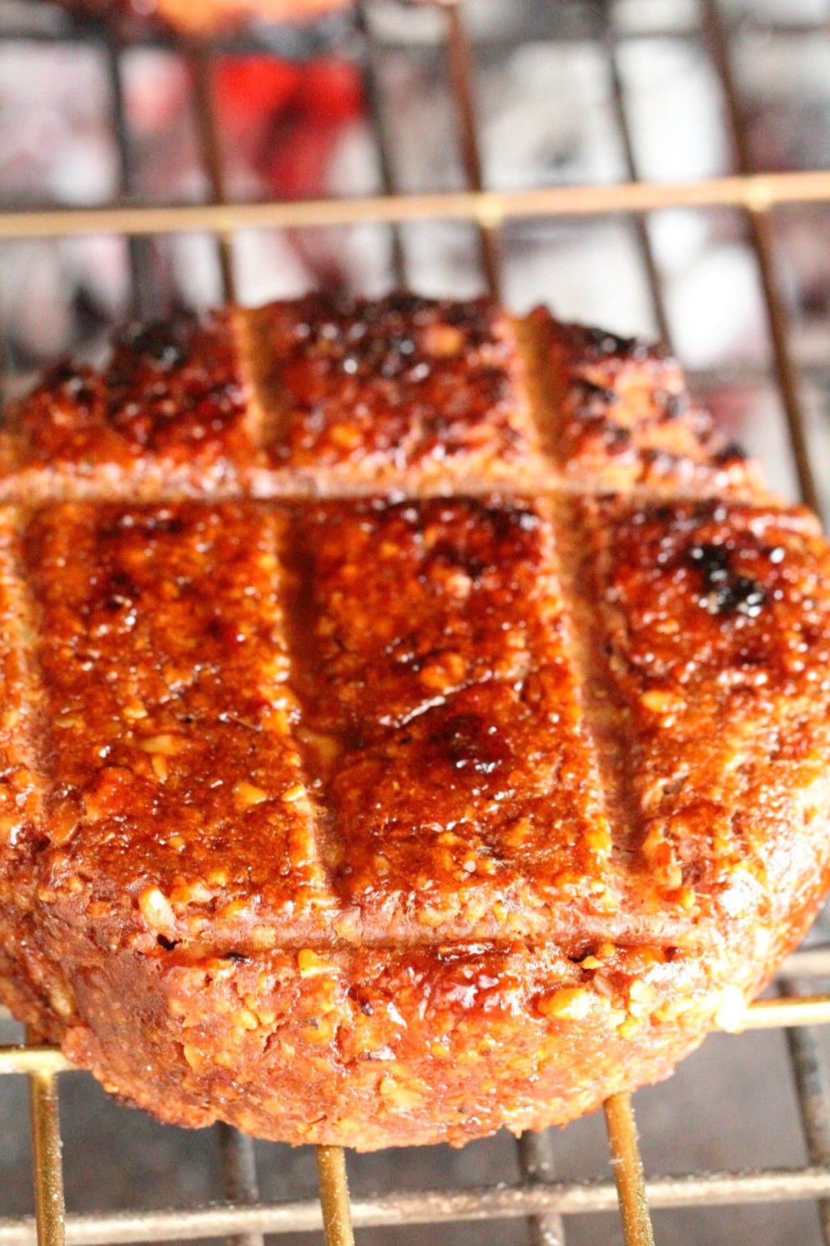 Vegan burger cooking on the grill. 