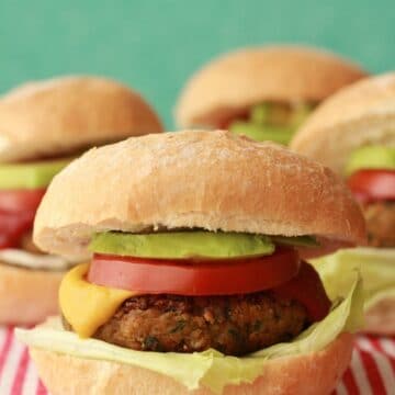 Chickpea burgers on a red and white tablecloth.