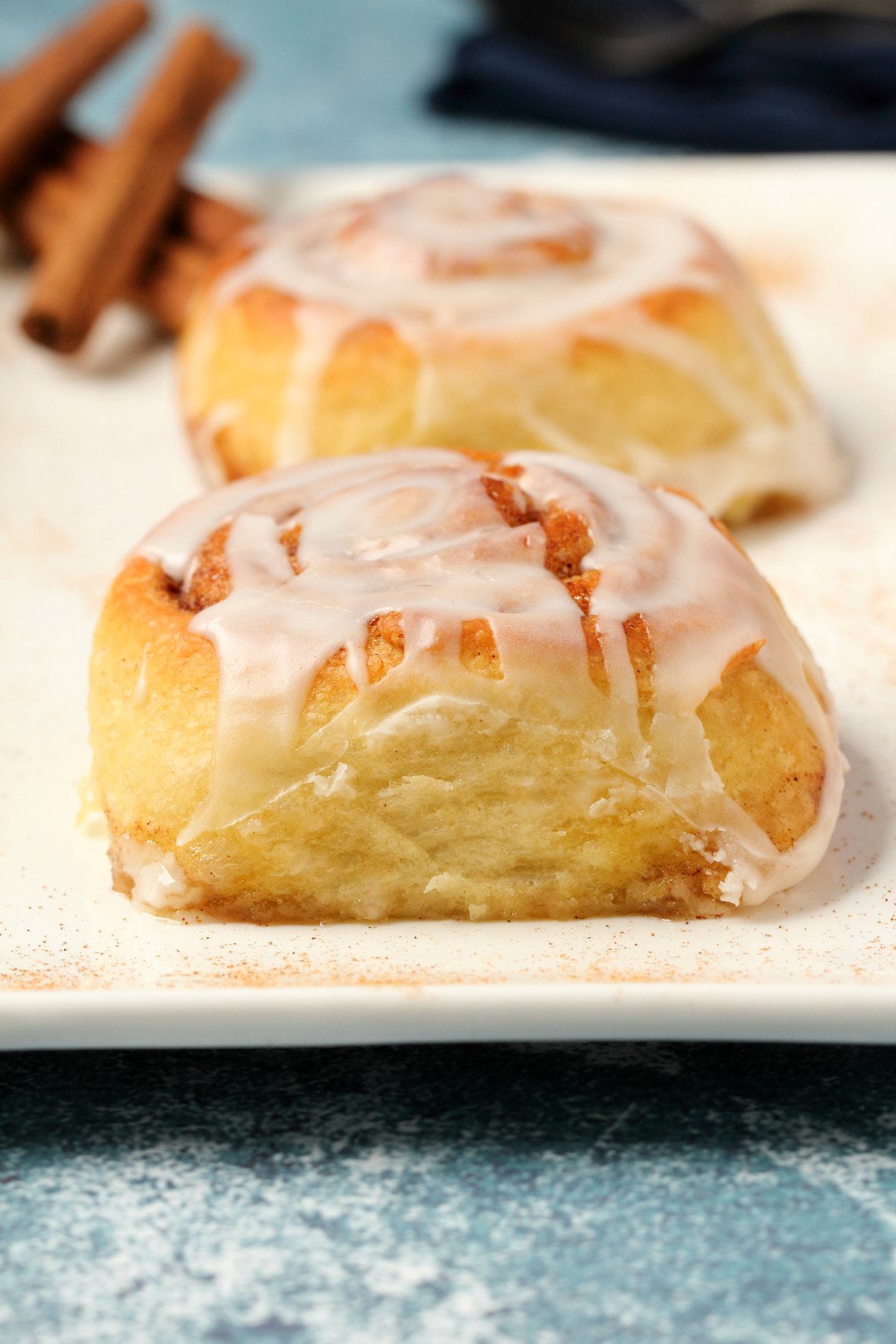 Vegan cinnamon rolls on a white plate. 