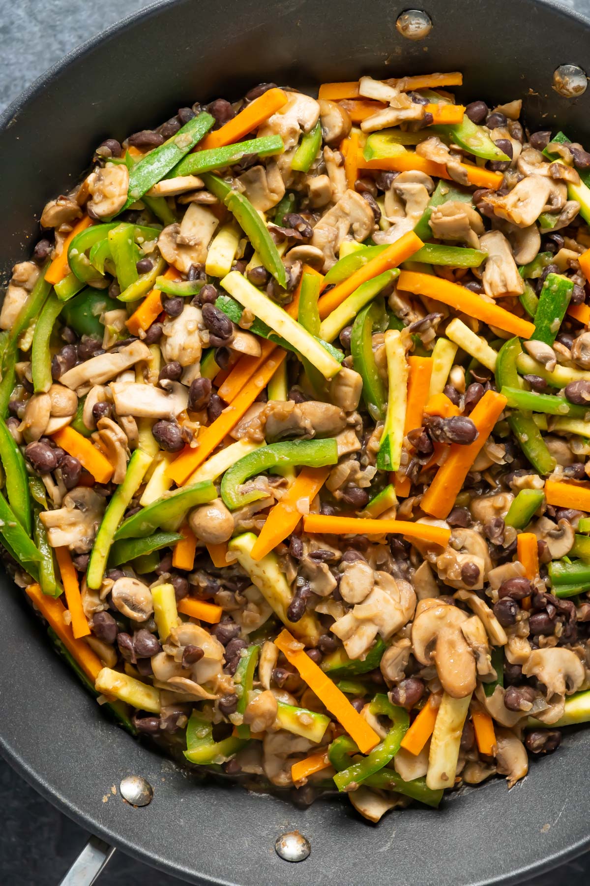 Sautéed veggies in a pan.