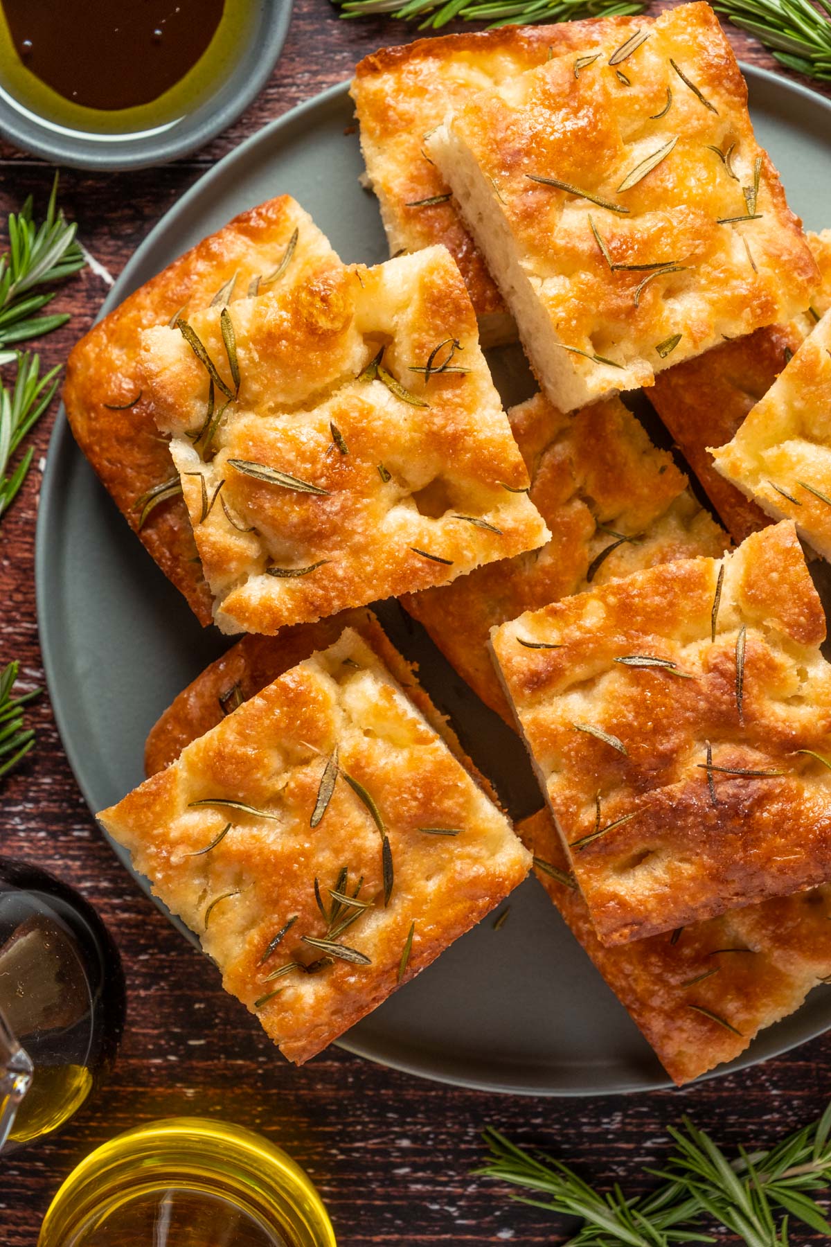 Vegan focaccia stacked up on a plate.