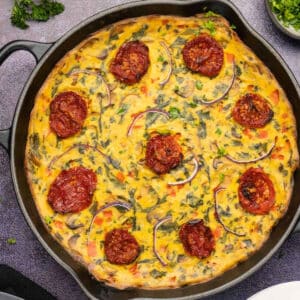 Baked vegan frittata in a cast iron skillet.