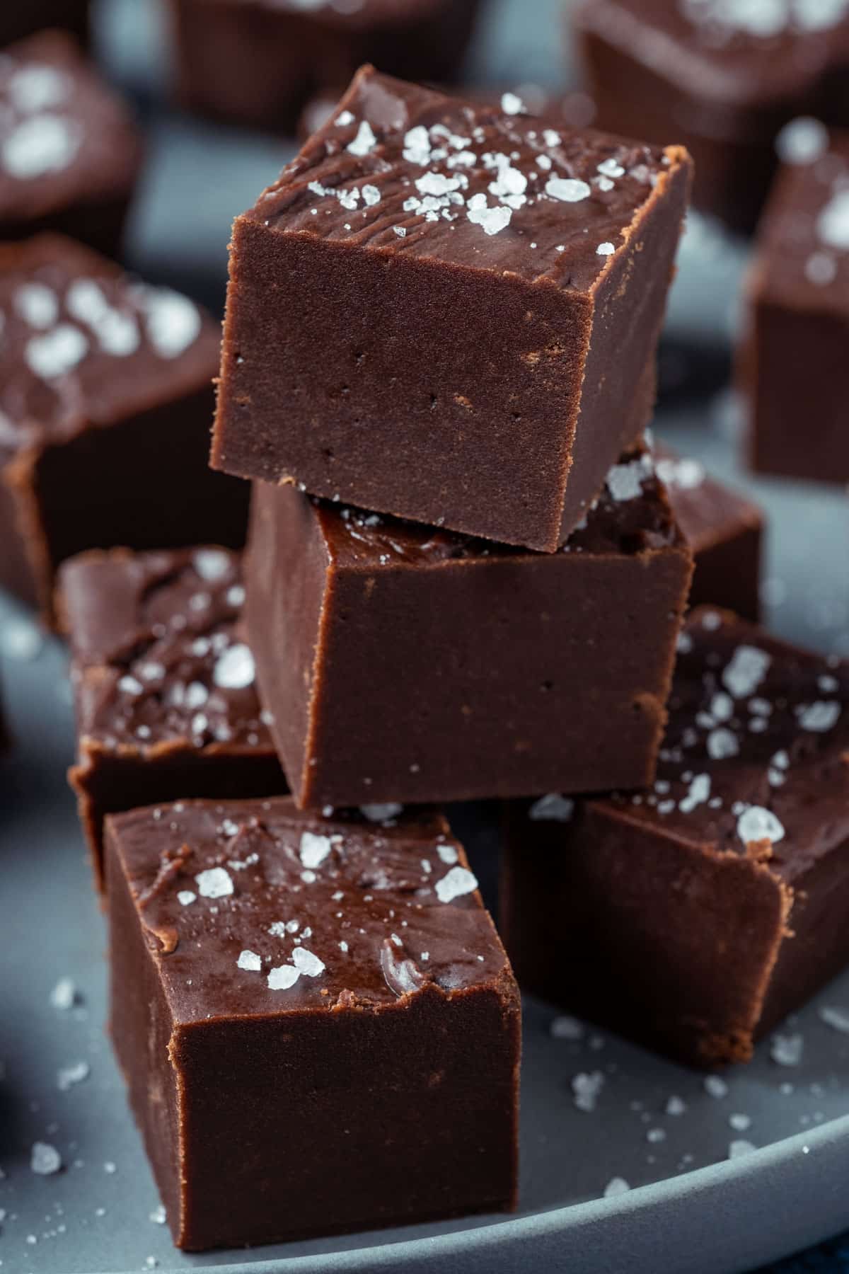 Fudge stacked up on a gray plate.