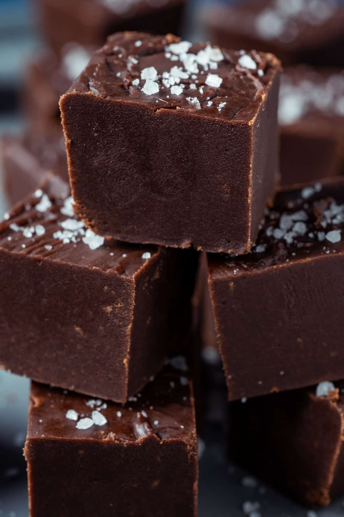 Vegan fudge stacked up on a plate.