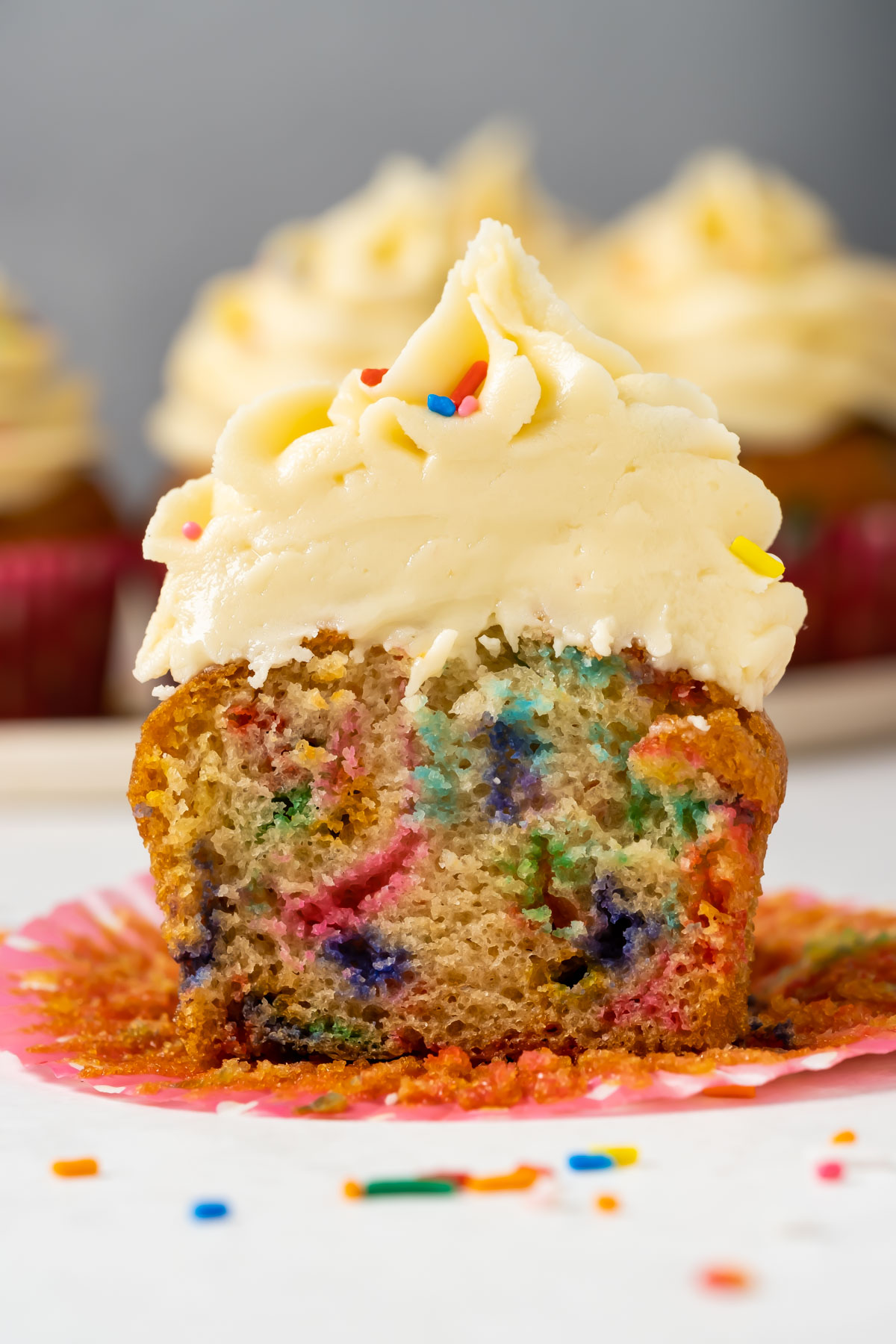 Vegan funfetti cupcake cut in half.