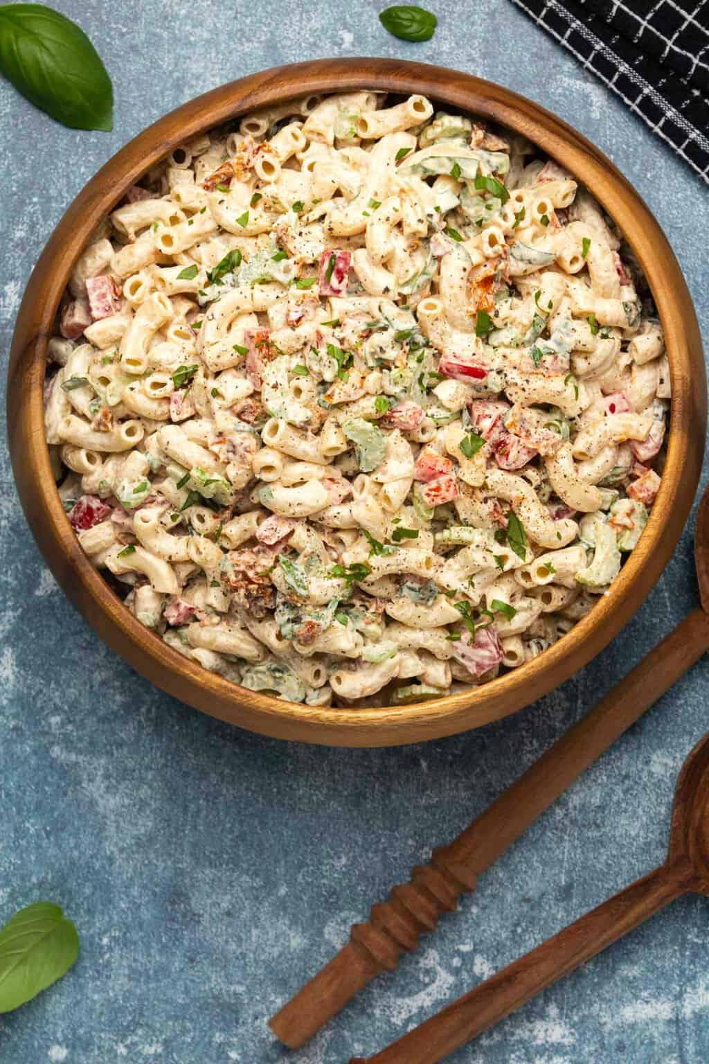 Vegan macaroni salad in a wooden salad bowl. 