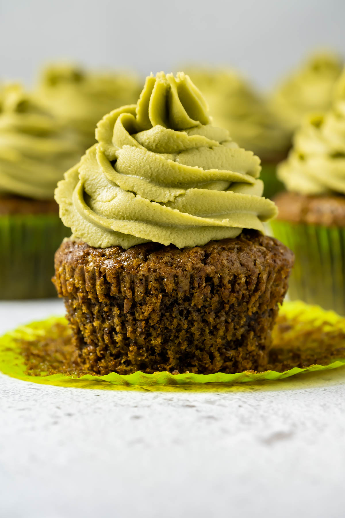 Matcha cupcake with the liner pulled down.