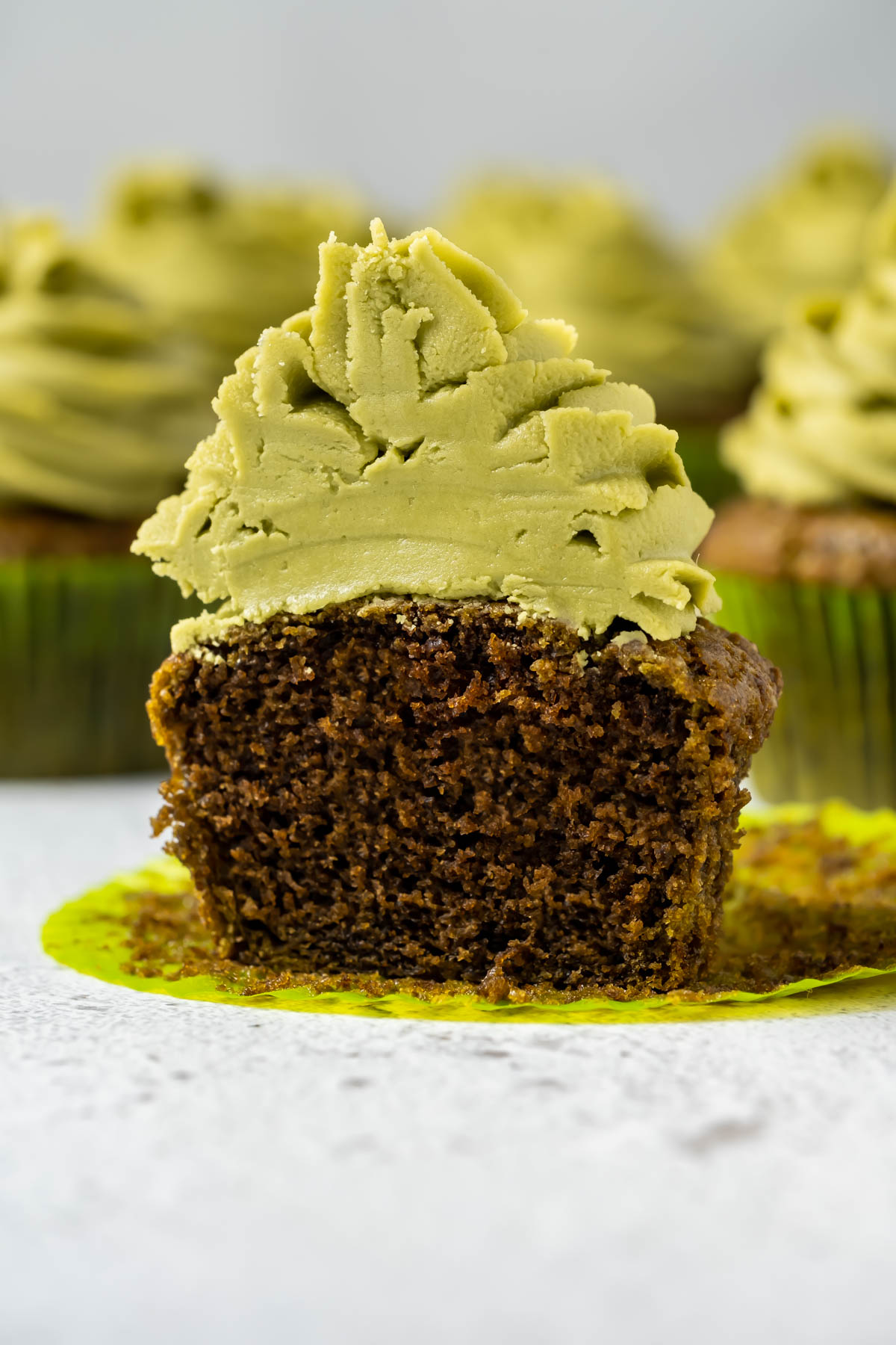 Vegan matcha cupcake cut in half.