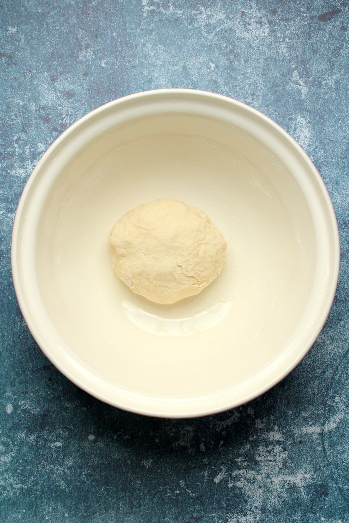 Ball of dough in a bowl.