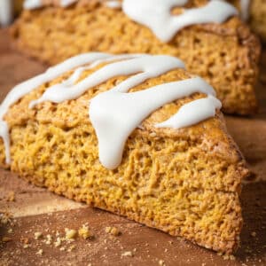 Vegan pumpkin scones on a wooden board.