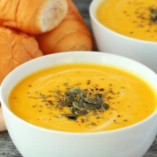 Vegan pumpkin soup in white bowls.