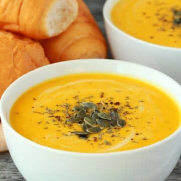 Vegan pumpkin soup in white bowls.