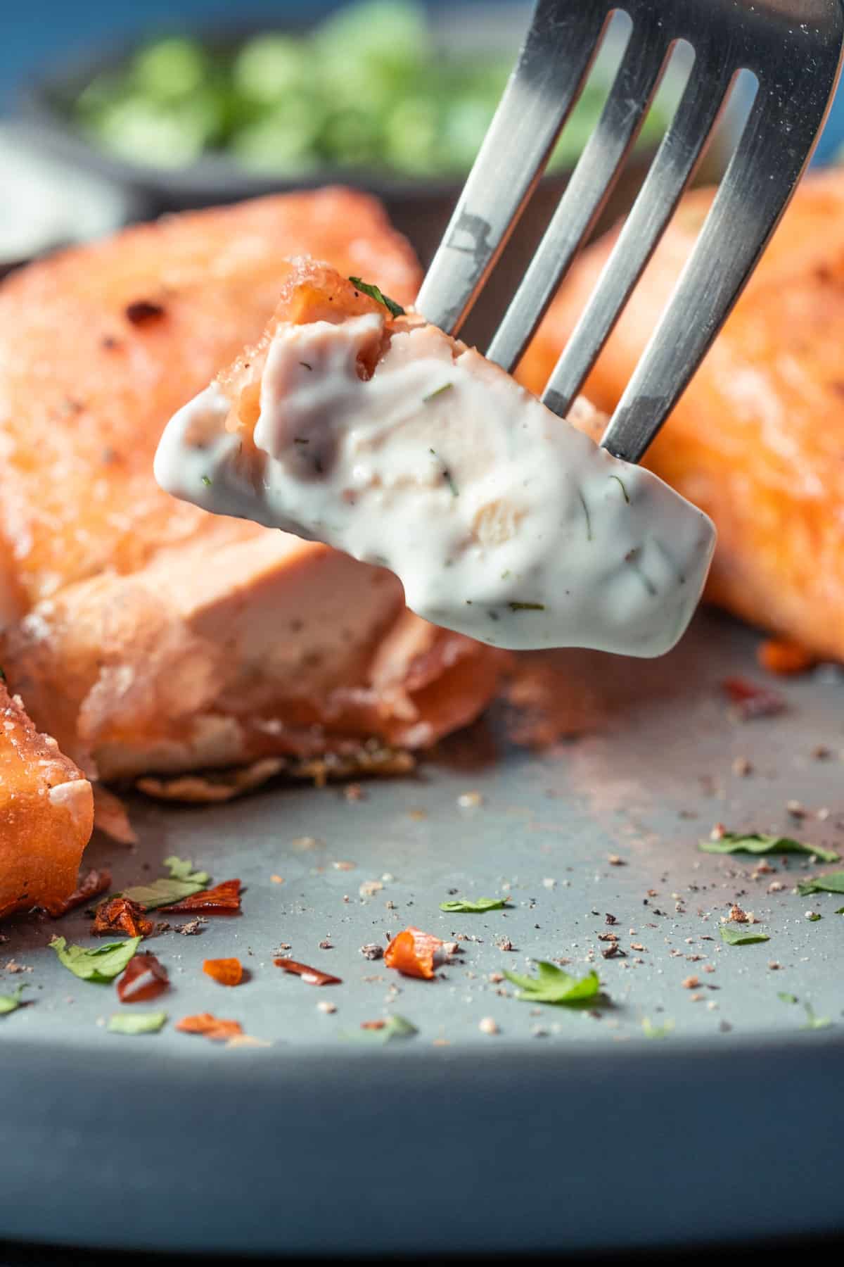 Piece of vegan salmon coated in tartar sauce.