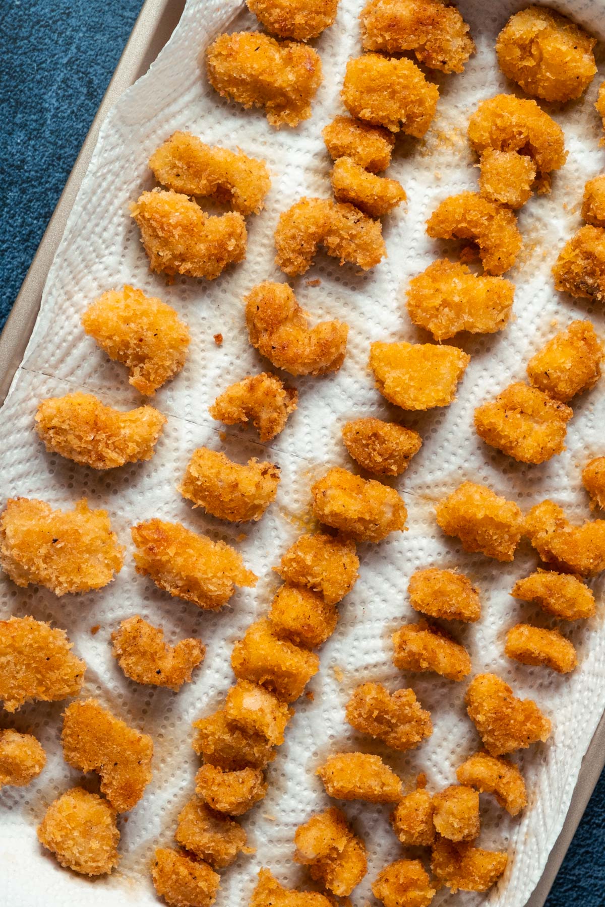 Vegan shrimp on a baking sheet lined with paper towels.