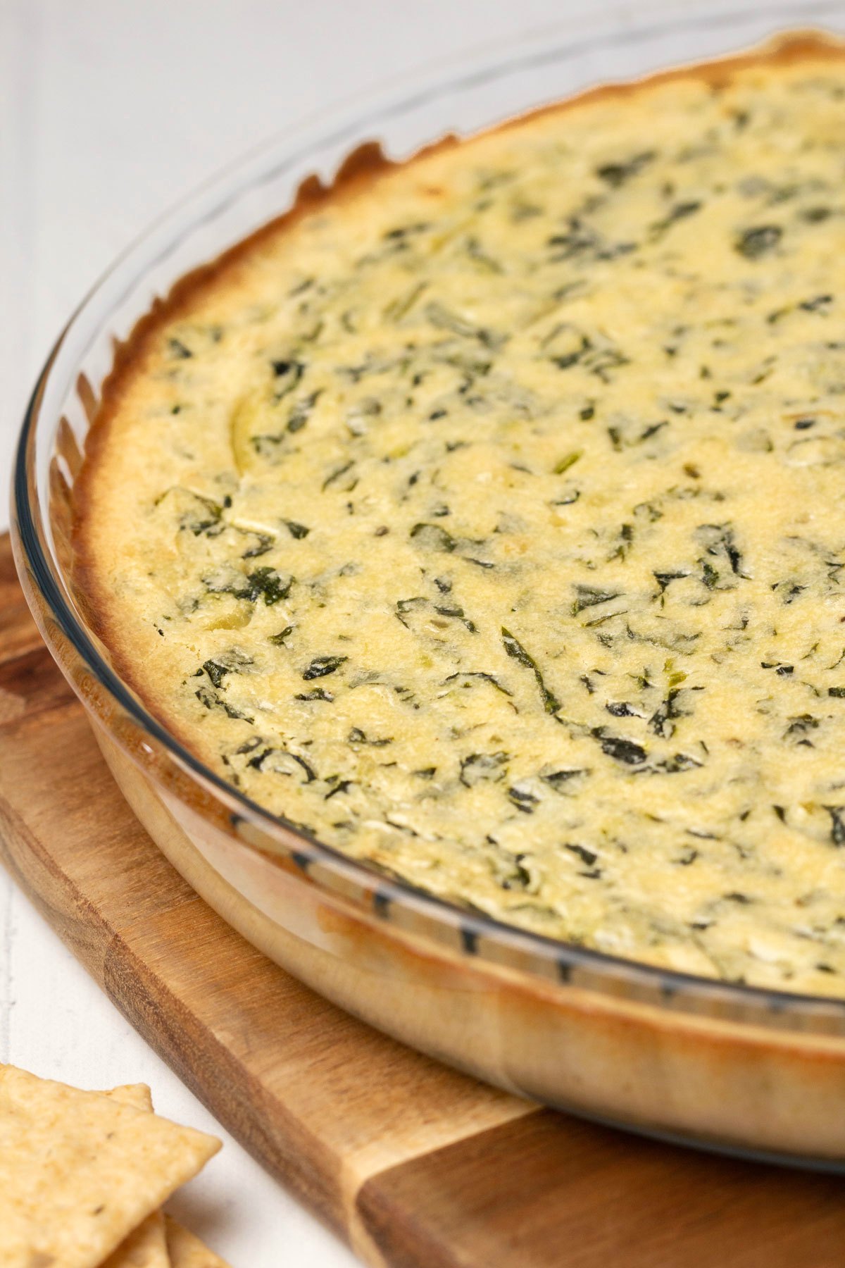 Vegan spinach dip in a round glass dish. 