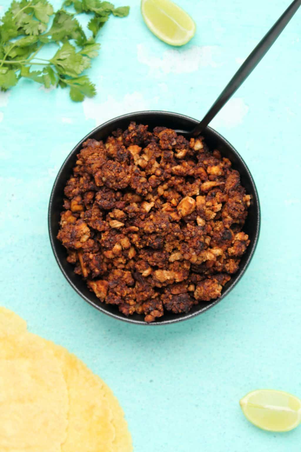 Vegan taco meat in a black bowl. 