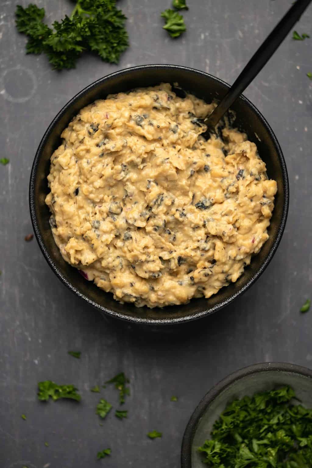 Vegan tuna in a black bowl. 